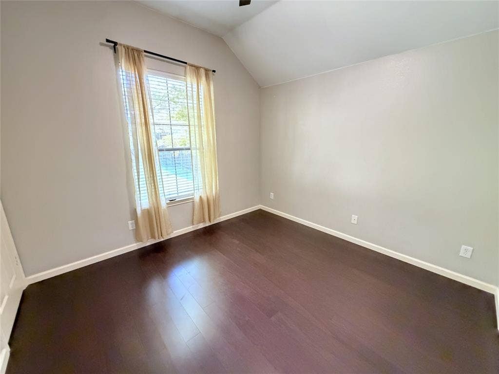 8100 Purple Martin Way, McKinney, TX 75072 Vaulted ceiling, dark wood-finish flooring, neutral wall tones, window with blinds
