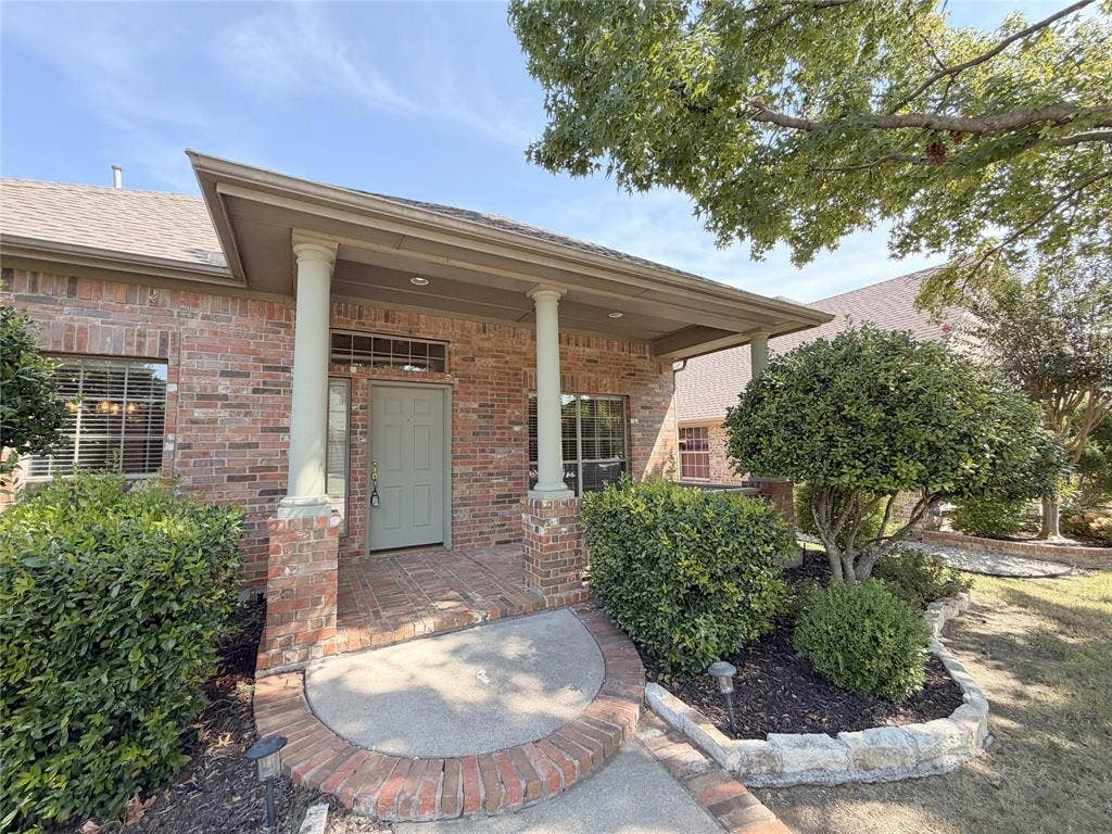 8100 Purple Martin Way, McKinney, TX 75072 Brick exterior with a covered entry and dual columns