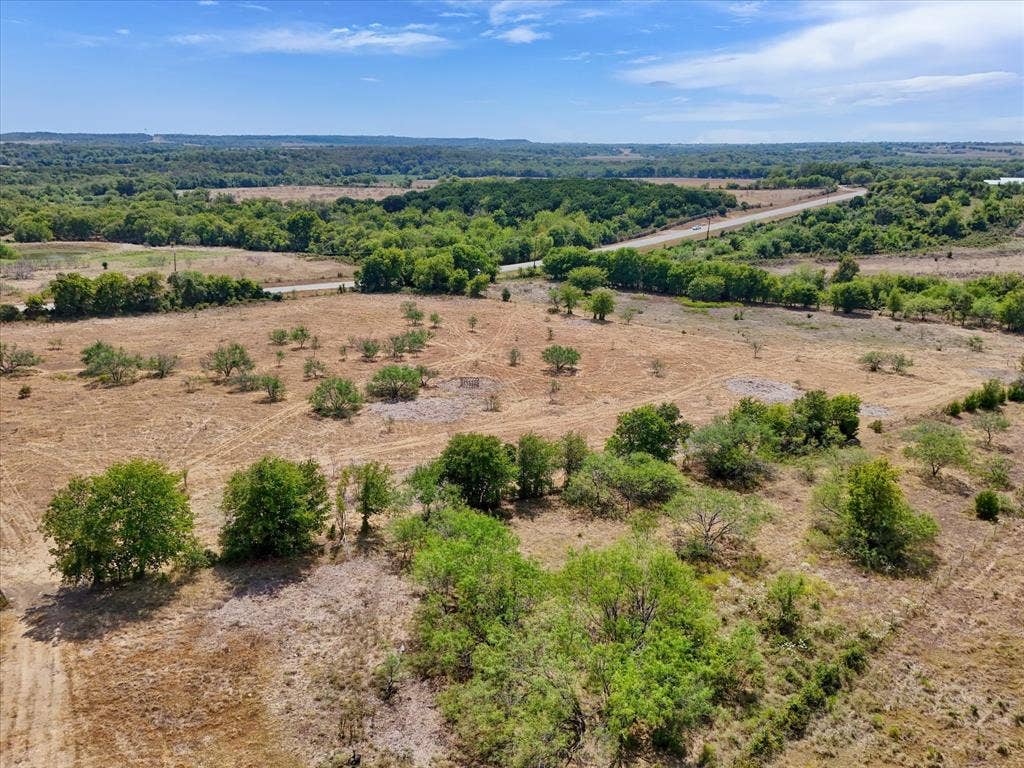 TBD Horne Hill Road, Moody, TX 76557 Expansive acreage featuring established trees, varied topography, and a distant road