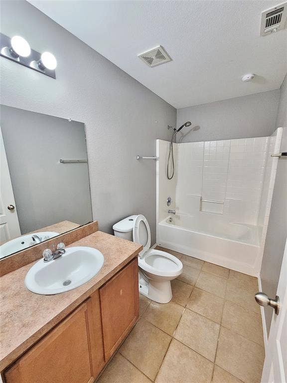 1229 Pine Forest Drive, Princeton, TX 75407 Bathroom with a wood-finish vanity, integrated sink, and a combination shower/tub