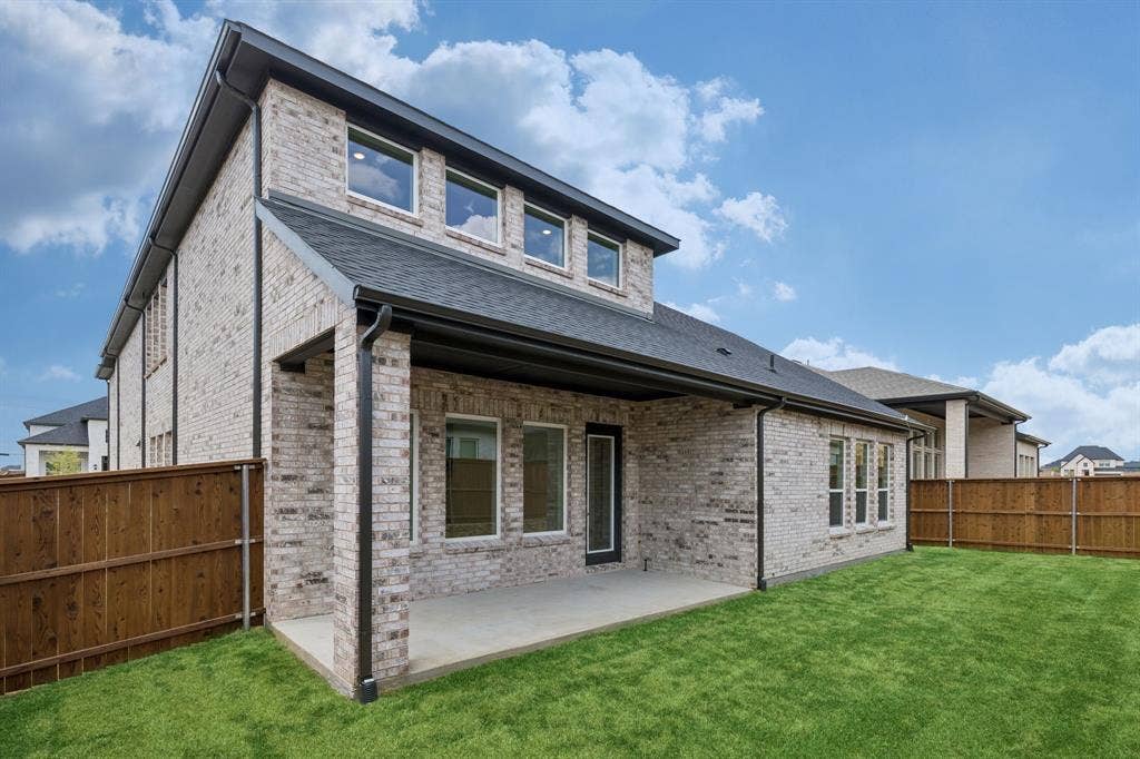 The kiddos and pets will enjoy plenty of fun outdoor times in this private, fenced back yard with covered back patio.