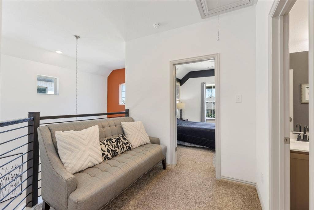 1456 Kit King Drive, Little Elm, TX 75036 Carpeted upper level featuring a metal railing, vaulted ceiling, and recessed lighting