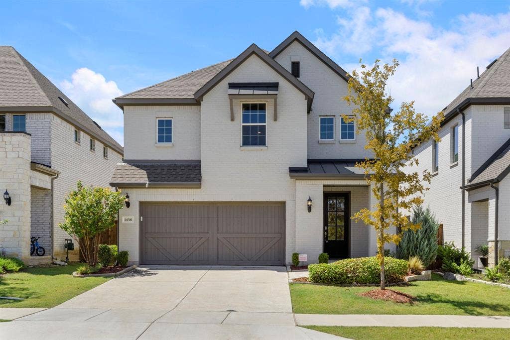 1456 Kit King Drive, Little Elm, TX 75036 Two-story exterior with white brick and dark grey trim