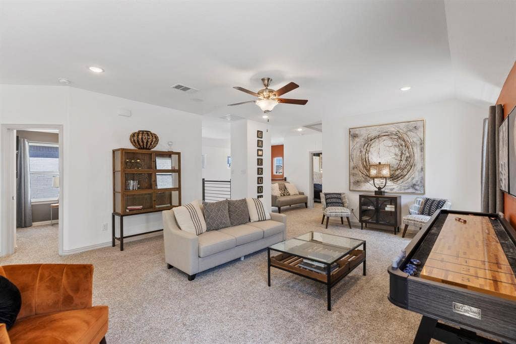 1456 Kit King Drive, Little Elm, TX 75036 Spacious room featuring vaulted ceilings, recessed lighting, a ceiling fan, and light-toned carpet flooring