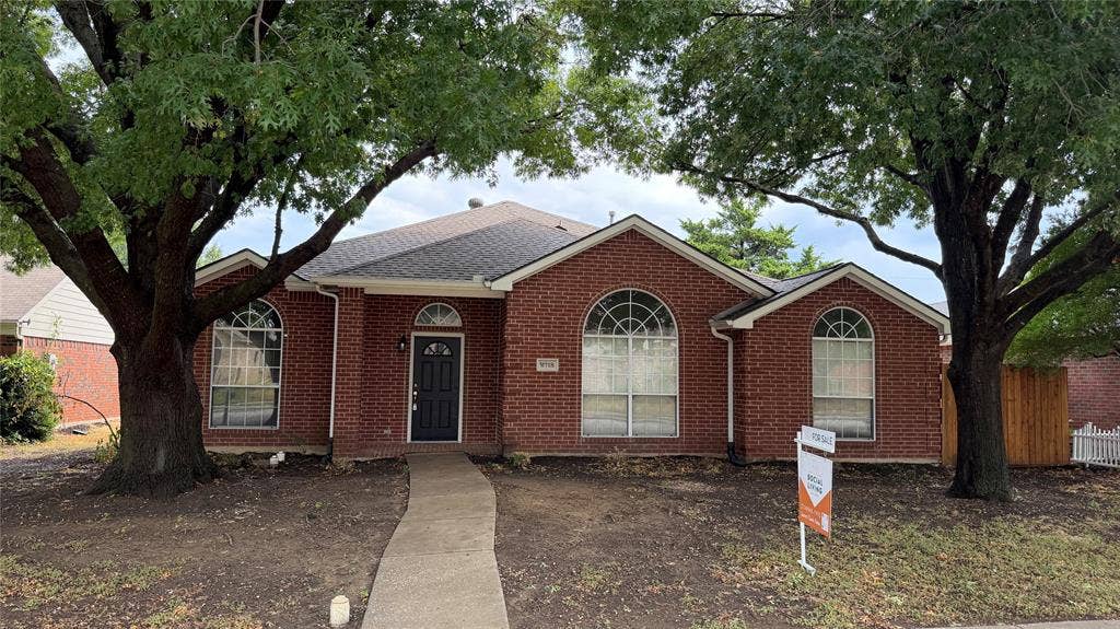 2718 High Pointe Boulevard, McKinney, TX 75071 Brick exterior with a gabled roof and arched windows