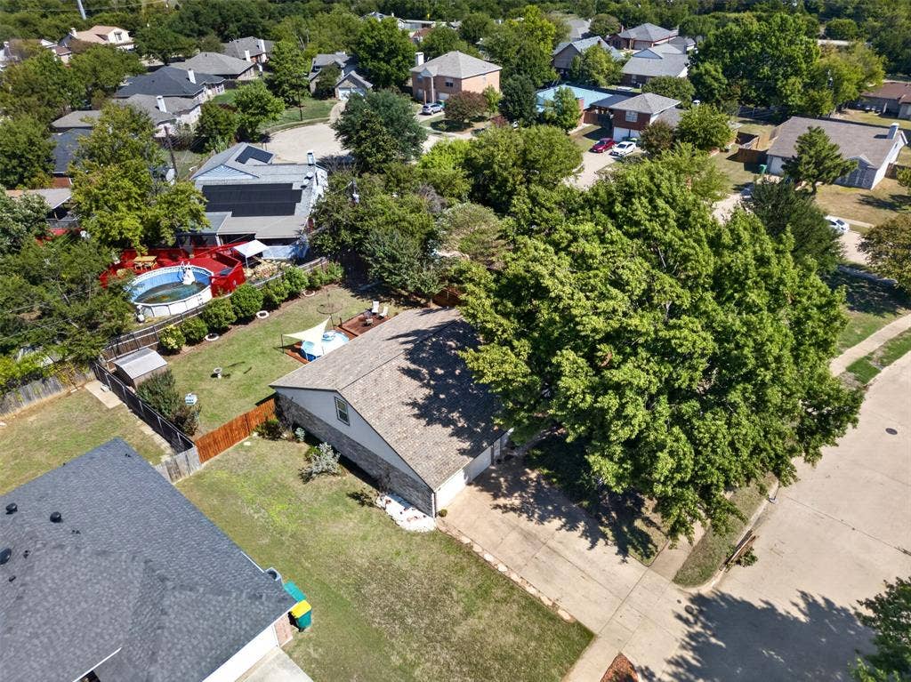 203 Briarglen Drive, Cedar Hill, TX 75104 Expansive property featuring a paved driveway, mature trees, and a private fenced yard with an above-ground pool