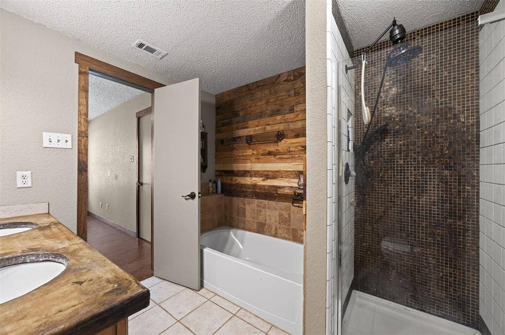 203 Briarglen Drive, Cedar Hill, TX 75104 Dual vanity with integrated sinks, a tub/shower combination, and a separate walk-in shower with mosaic tile