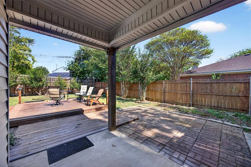 203 Briarglen Drive, Cedar Hill, TX 75104 Covered patio with concrete flooring, wood deck, and wood privacy fencing