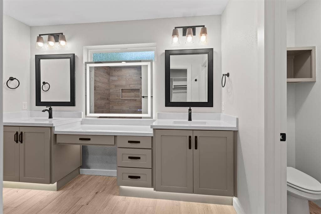 16514 Crossing Circle, Lindale, TX 75771 Dual vanity with white countertops, integrated sinks, and neutral cabinetry