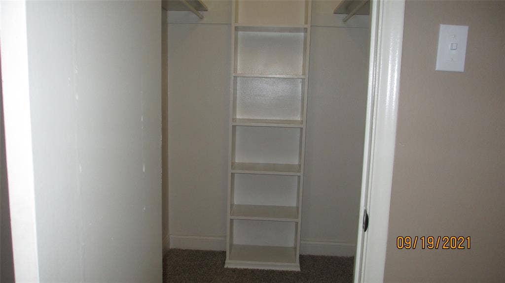 13433 Blossomheath Lane, Dallas, TX 75240 Walk in closet has shelves