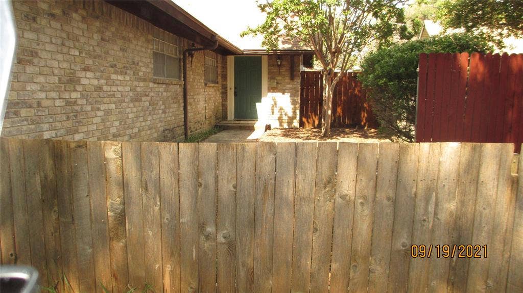 13433 Blossomheath Lane, Dallas, TX 75240 Back door leads out to garage