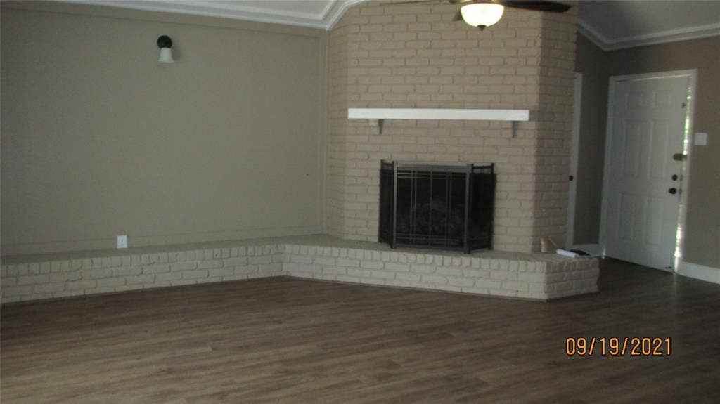 13433 Blossomheath Lane, Dallas, TX 75240 Great fireplace with gas logs, designer paint and wood floors