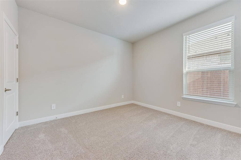 Unfurnished room featuring carpet floors