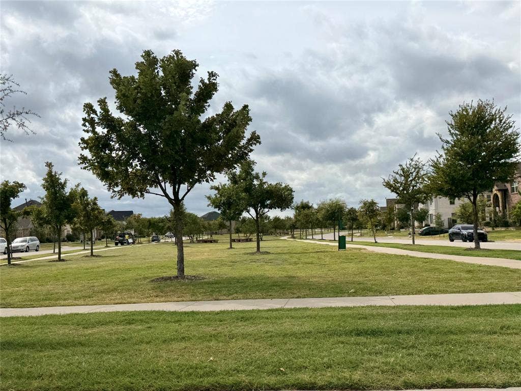 1196 Putnam Drive, Frisco, TX 75036 At the end of the street Putnam, there is an expansive green space featuring a manicured lawn and mature trees with walking trails