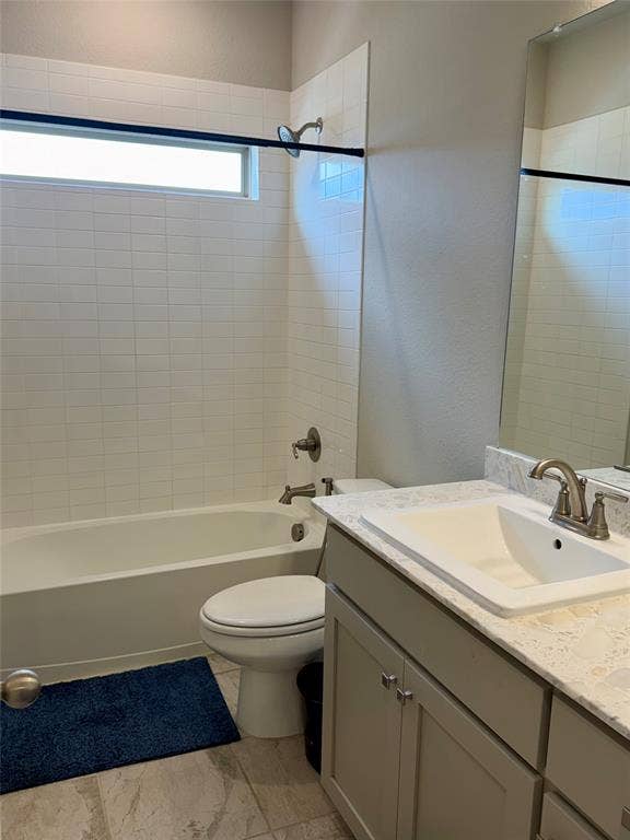 1196 Putnam Drive, Frisco, TX 75036 Full bathroom featuring a vanity with an integrated sink, light-toned countertop, and undermount cabinetry