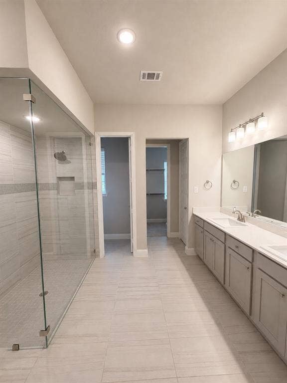 1196 Putnam Drive, Frisco, TX 75036 Walk-in shower with clear glass enclosure and tile surround