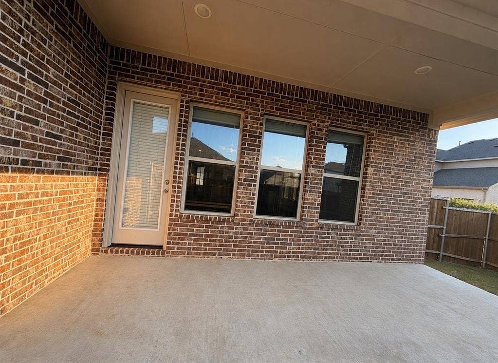 1196 Putnam Drive, Frisco, TX 75036 Covered patio with brick exterior, concrete flooring, and recessed lighting