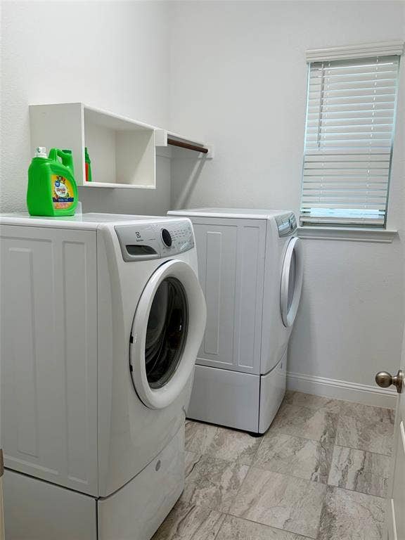1196 Putnam Drive, Frisco, TX 75036 Laundry area equipped with washer and dryer featuring tile flooring, white walls, built-in shelving, a clothes rod, and a window with blinds