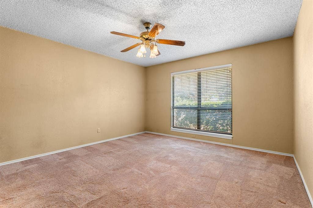 544 Jason Street, Robinson, TX 76706 Window with horizontal blinds, overhead ceiling fan with light fixture, and wall-to-wall carpeting