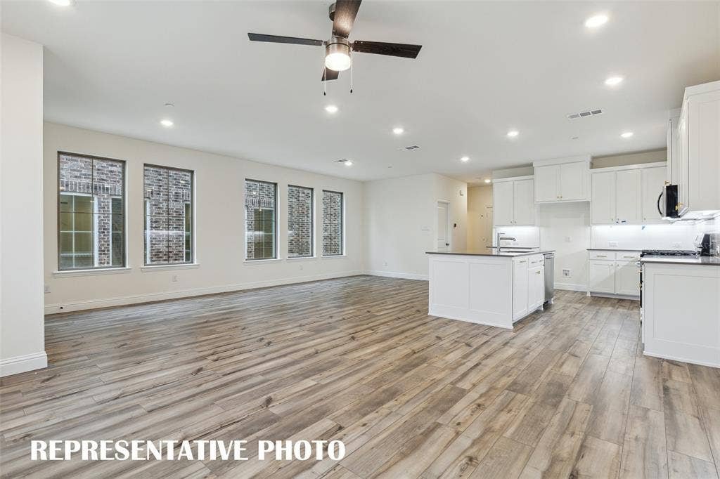 4733 Lunker Street, McKinney, TX 75071 Offering a wall of windows in the dining-kitchen area, the entire family will love the open and airy feeling this home has to offer! REPRESENTATIVE PHOTO