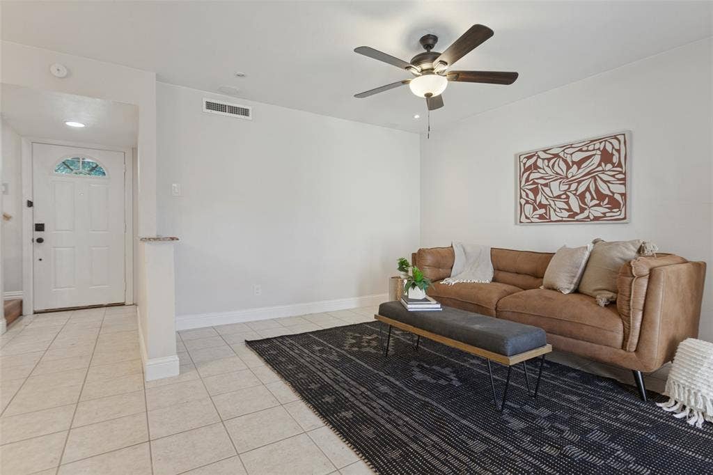 351 Valley Park Drive, Garland, TX 75043 351 Vally Park Dr. - Updated living area featuring fresh paint, newer tile flooring, ceiling fan and French doors with built-in blinds that open to the back patio.