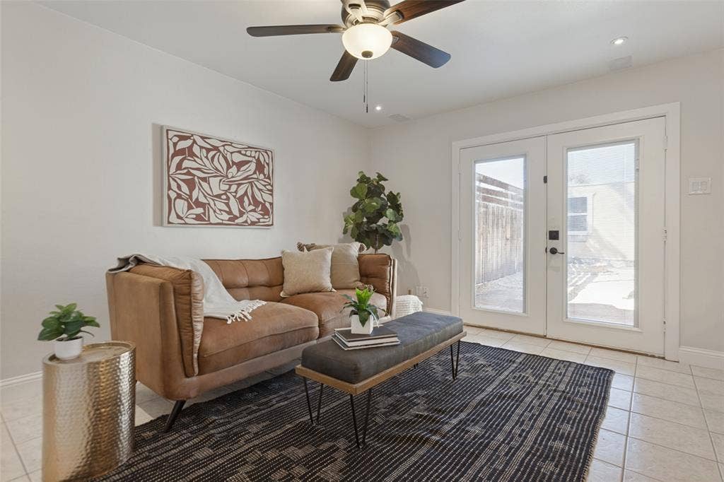 351 Valley Park Drive, Garland, TX 75043 351 Vally Park Dr. - Updated living area featuring fresh paint, newer tile flooring, ceiling fan and French doors with built-in blinds that open to the back patio.