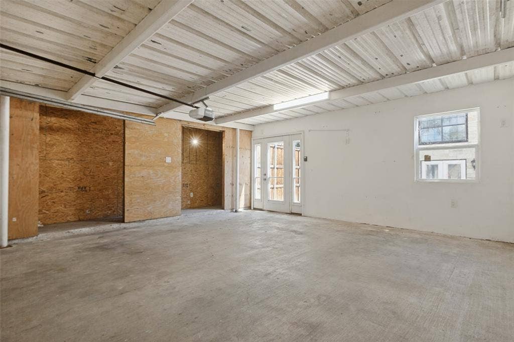 351 Valley Park Drive, Garland, TX 75043 351 Vally Park Dr. - Detached garage featuring a newer garage door and opener, providing convenient parking and additional storage space.