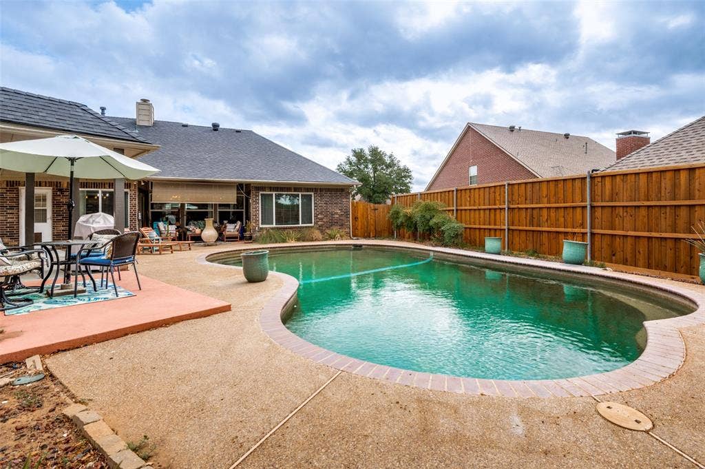 5201 Alexander Drive, Flower Mound, TX 75028 exposed aggregate concrete deck, which offers a textured, slip-resistant surface.
