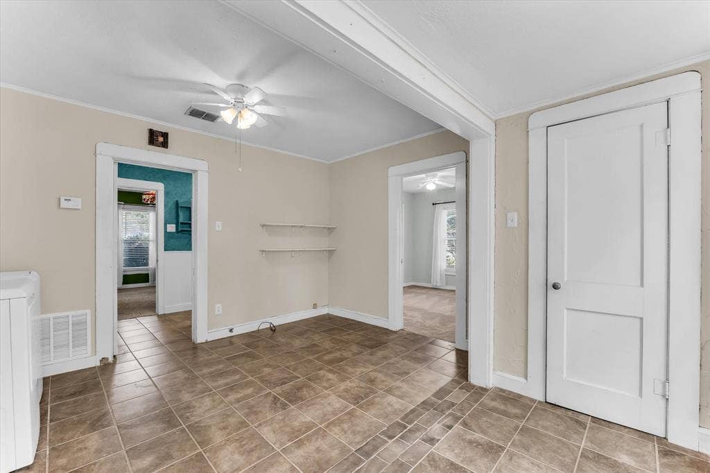 302 W Billington Drive, Robinson, TX 76706 Tiled flooring with neutral wall tones and white trim