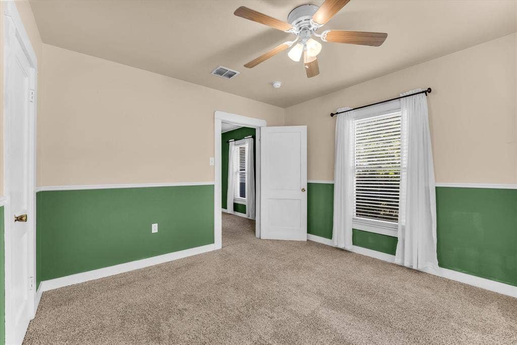 302 W Billington Drive, Robinson, TX 76706 Wall-to-wall carpeting, two-tone painted walls, and white trim throughout