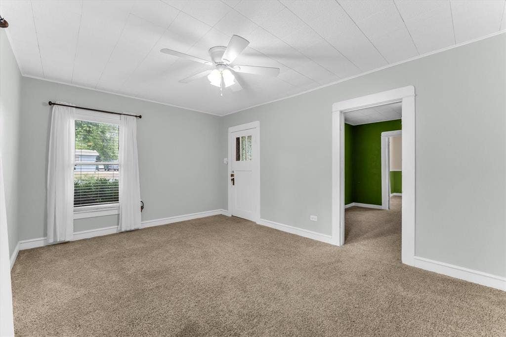 302 W Billington Drive, Robinson, TX 76706 Carpeted room with light gray walls, a white ceiling fan, and a paneled ceiling