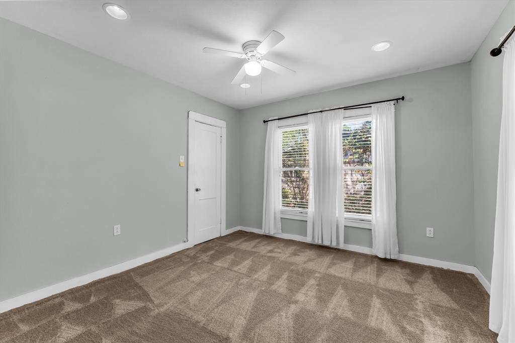302 W Billington Drive, Robinson, TX 76706 Recessed ceiling lighting, ceiling fan, neutral wall color, two windows with blinds, and brown patterned carpet