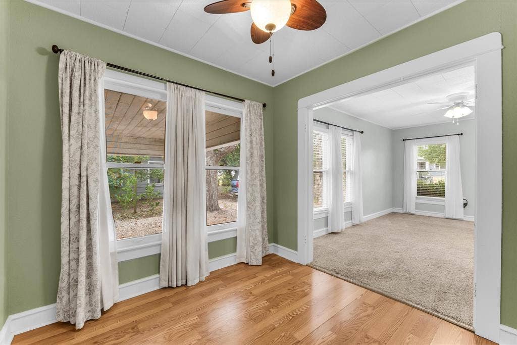 302 W Billington Drive, Robinson, TX 76706 Warm wood-finish flooring, light green wall paint, and a ceiling fan with integrated lighting