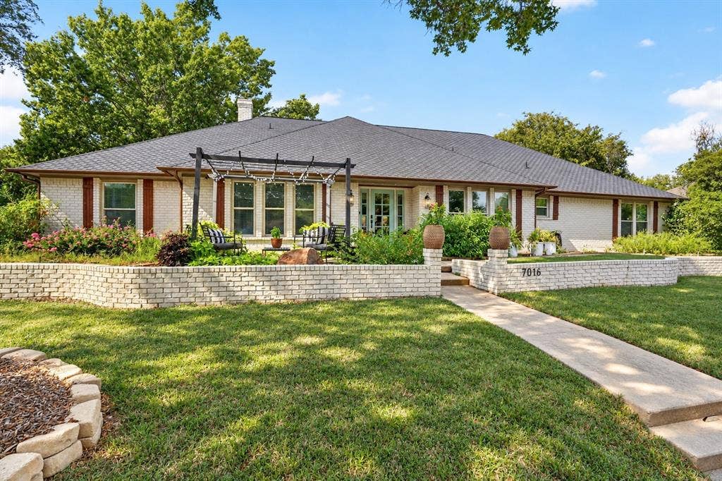 7016 Battle Creek Road, Fort Worth, TX 76116 White brick exterior with dark shingle roof