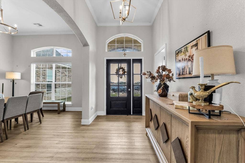 Double front doors with decorative glass panels