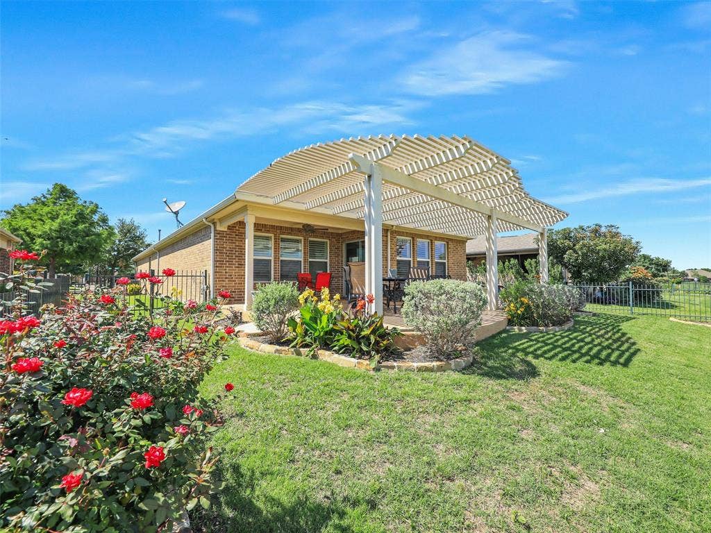 7470 Birmingham Forest Drive, Frisco, TX 75036 Back of property featuring a pergola and a yard