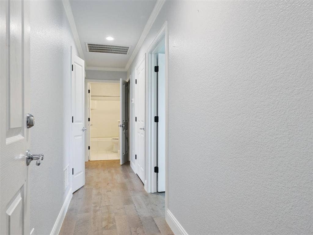 7470 Birmingham Forest Drive, Frisco, TX 75036 Hall from garage featuring two storage closets