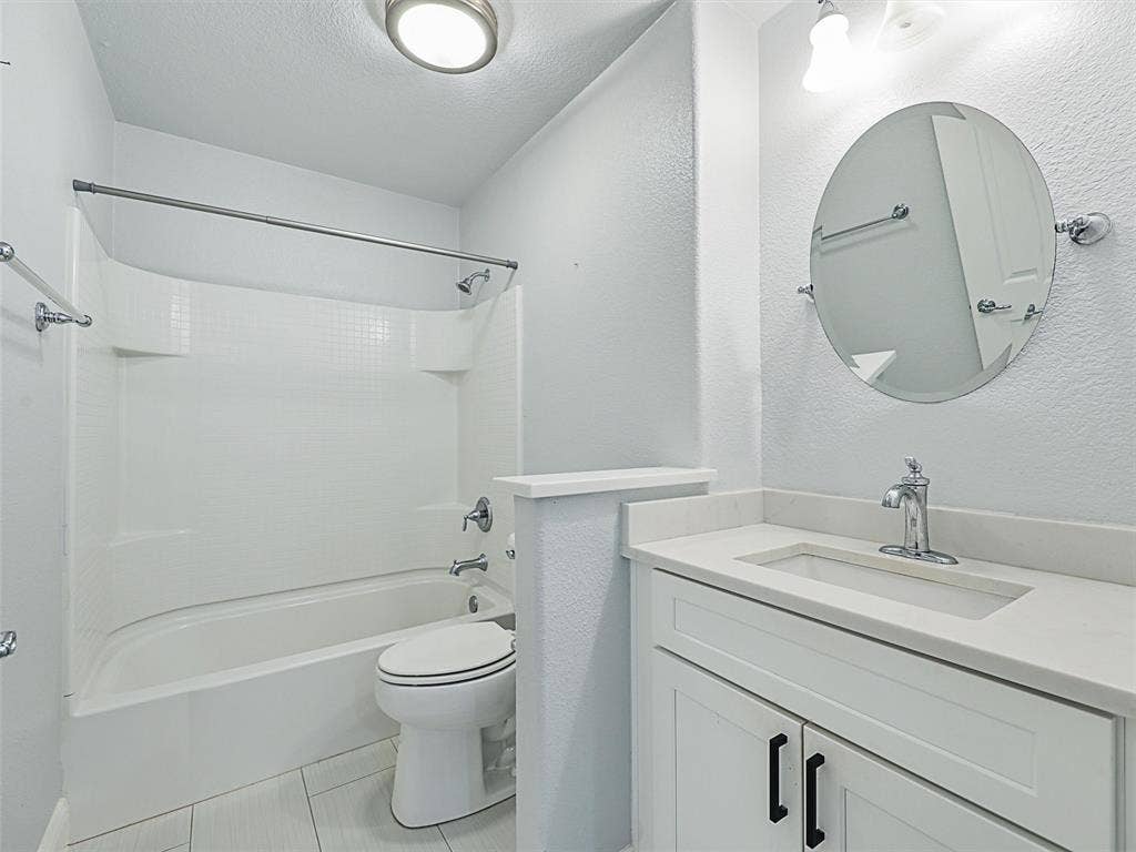 7470 Birmingham Forest Drive, Frisco, TX 75036 Full bathroom featuring bathtub / shower combination, tile floors, vanity