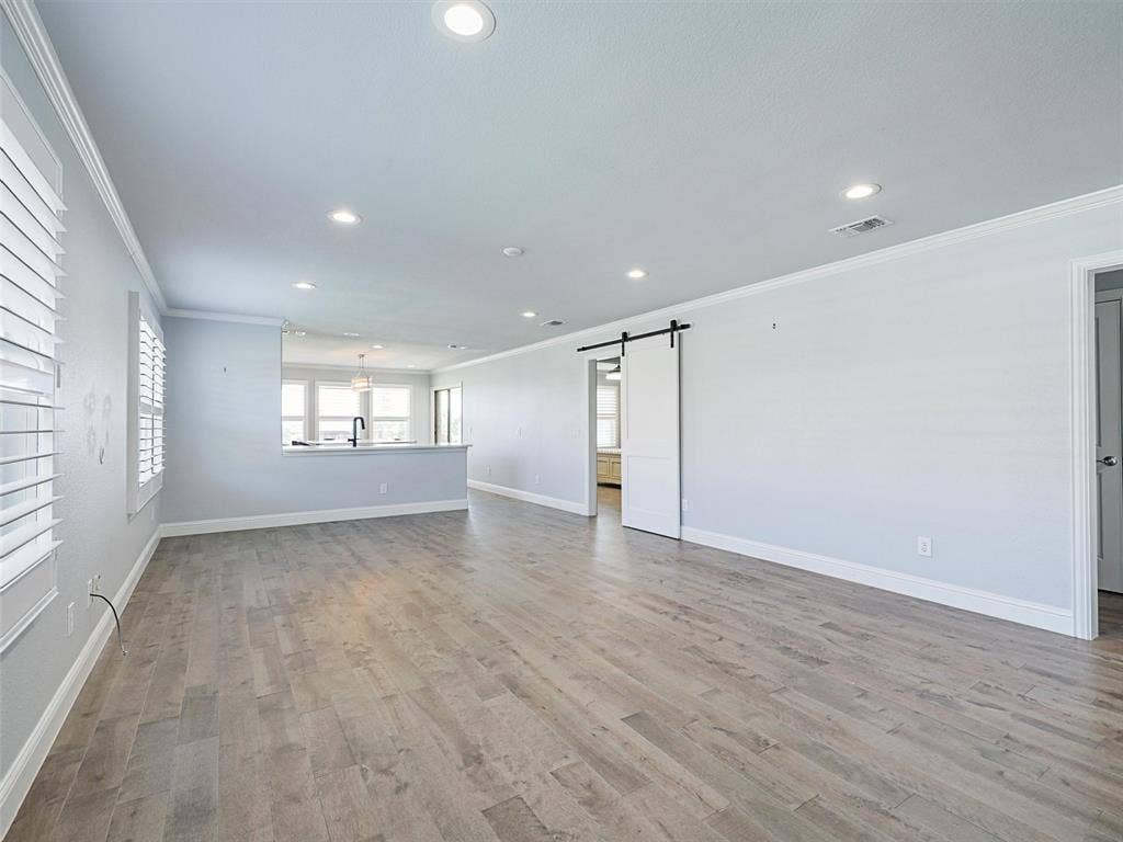 7470 Birmingham Forest Drive, Frisco, TX 75036 Living area with Luxury Vinyl Plank (LVP) Flooring
