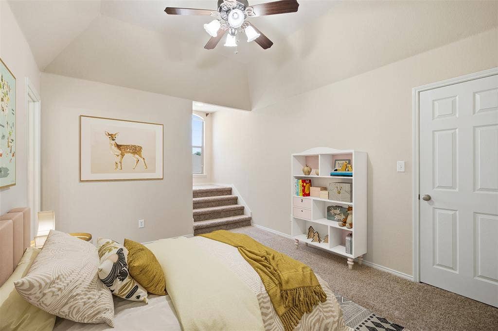 750 Village Green Drive, DeSoto, TX 75115 Vaulted ceiling with a ceiling fan. Virtually staged.
