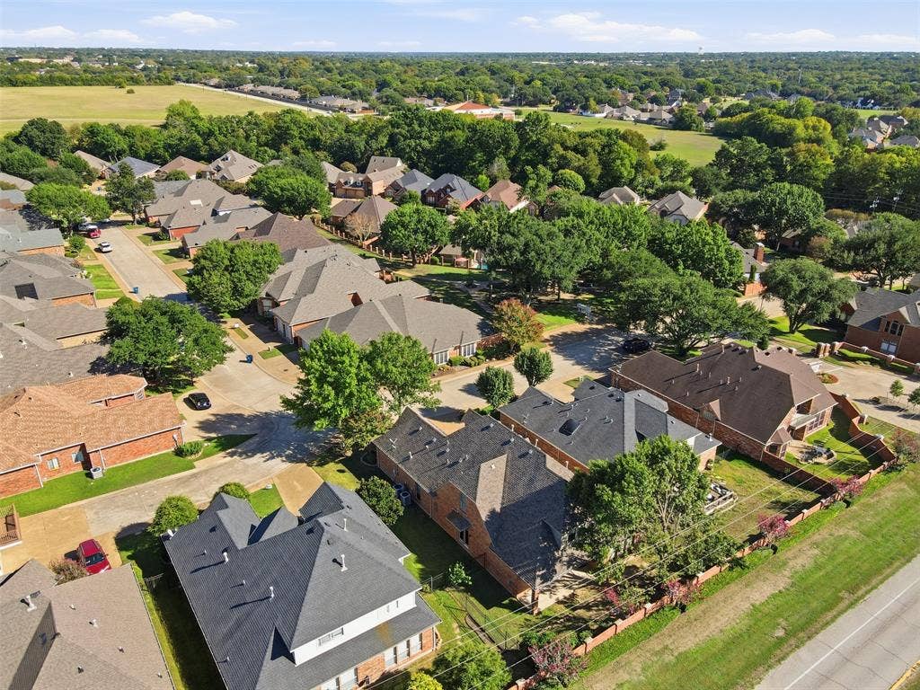 750 Village Green Drive, DeSoto, TX 75115 Residential neighborhood with established tree canopy and a paved street