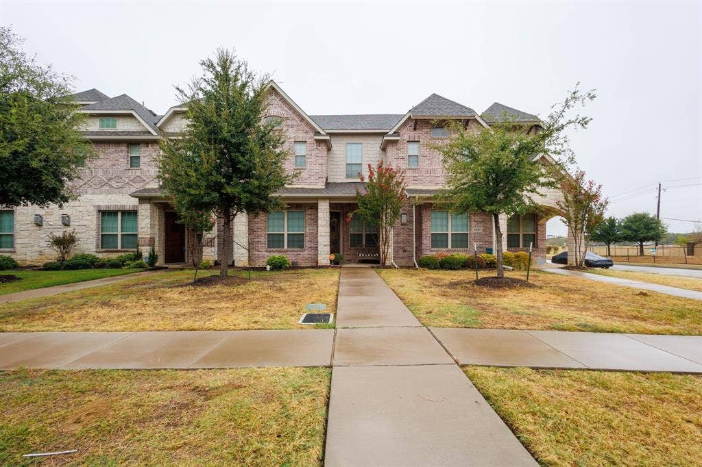 4814 Empire Way, Irving, TX 75038 Two-story brick and stone facade with multiple gables