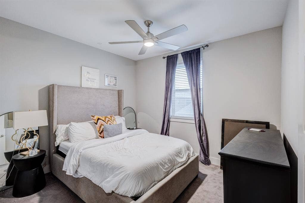 4814 Empire Way, Irving, TX 75038 Recessed window with blinds, overhead ceiling fan, light gray wall paint, and gray carpeting