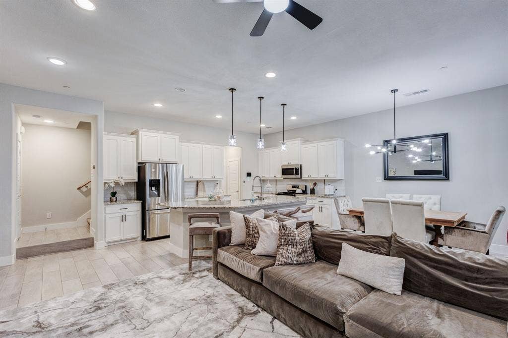 4814 Empire Way, Irving, TX 75038 Open-concept living space with wood-finish flooring, recessed lighting, and a ceiling fan