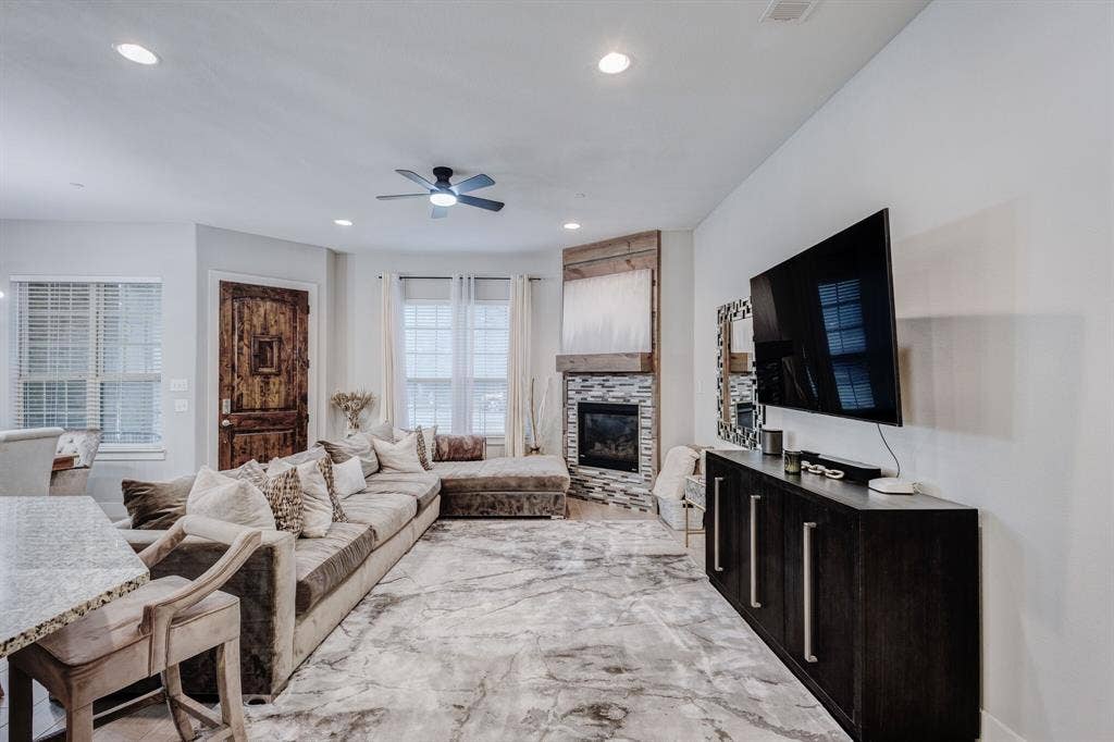 4814 Empire Way, Irving, TX 75038 Recessed lighting, ceiling fan, wood-finish flooring, stone-faced fireplace with wood mantel, and granite-finish countertop