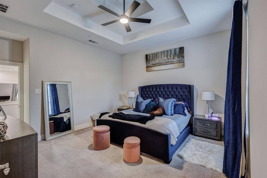 4814 Empire Way, Irving, TX 75038 Recessed ceiling with an integrated ceiling fan, light-toned wall paint, and light-toned carpet flooring