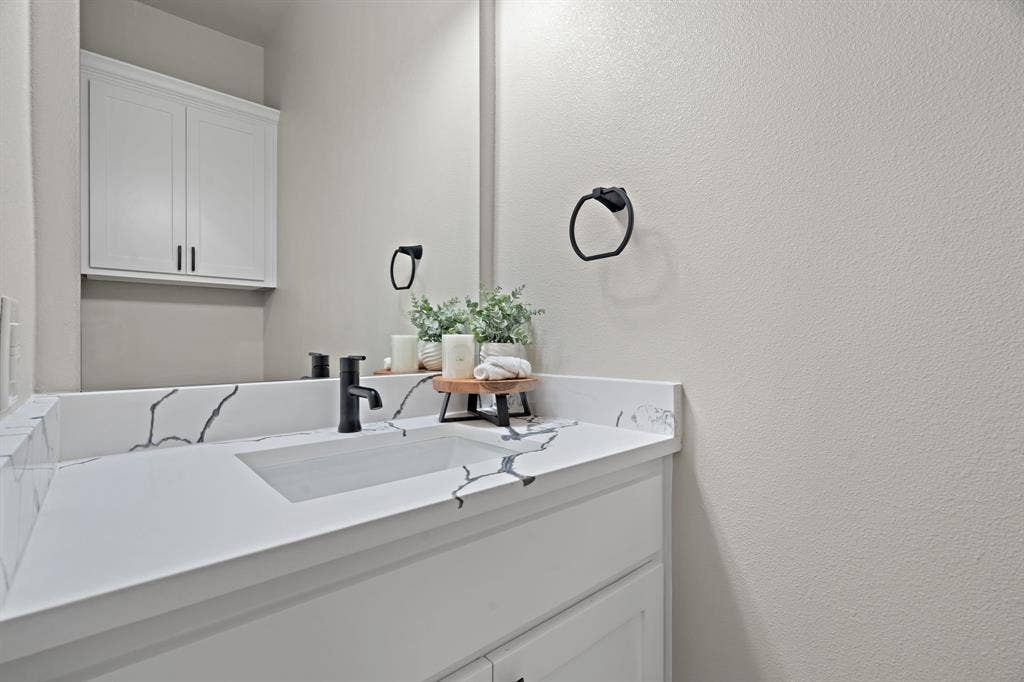 4205 County Road 570, Farmersville, TX 75442 half bath located near garage entrance by utility room