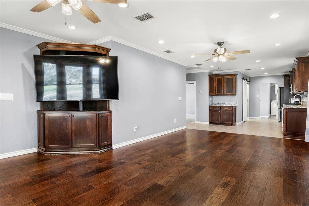 605 Dallas Street, Winona, TX 75792 Wood-finish flooring, built-in entertainment center with storage, recessed lighting, and ceiling fans