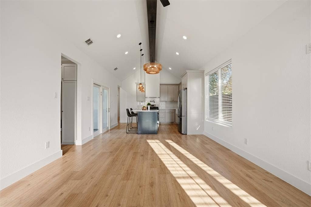 1601 Birdell Street, Fort Worth, TX 76105 Vaulted ceiling, recessed lighting, wood-finish flooring, kitchen island, and stainless steel appliances