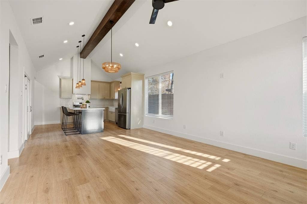 1601 Birdell Street, Fort Worth, TX 76105 Vaulted ceiling with an exposed wood beam, recessed lighting, wood-finish flooring, and a kitchen island with pendant lighting